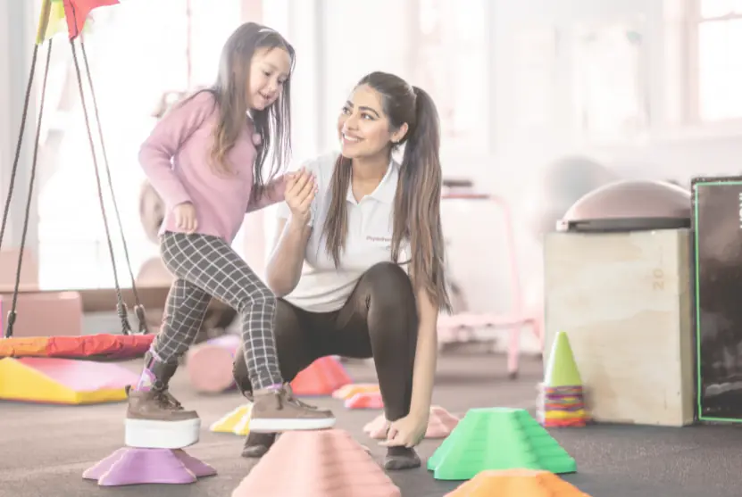 An occupational therapist with a child